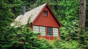 A red house in the woods.