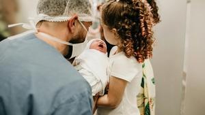 Newborn crying in the hospital.