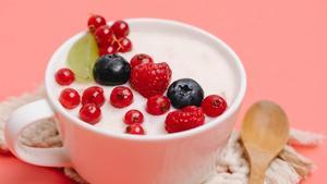 Yogurt with berries on top.