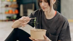 Woman eating a salad.