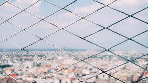 Close-up of a broken fence.