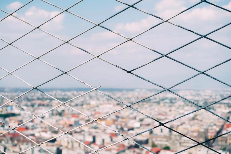 Close-up of a broken fence.